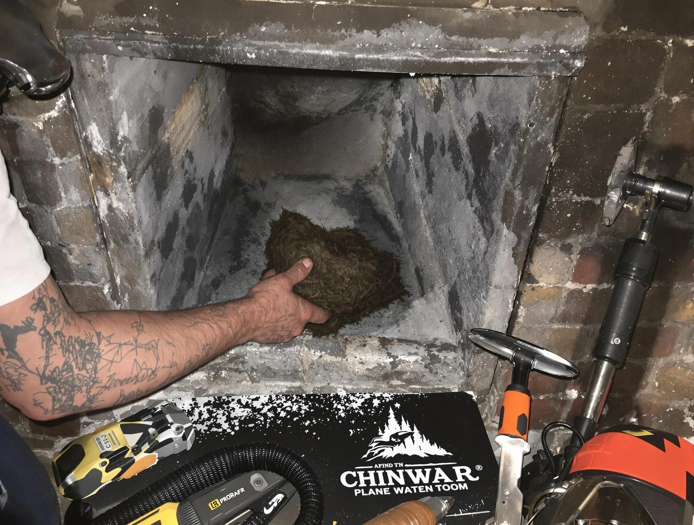 Franklin Chimney Sweep safely removing debris and screening chimney in Franklin, NJ